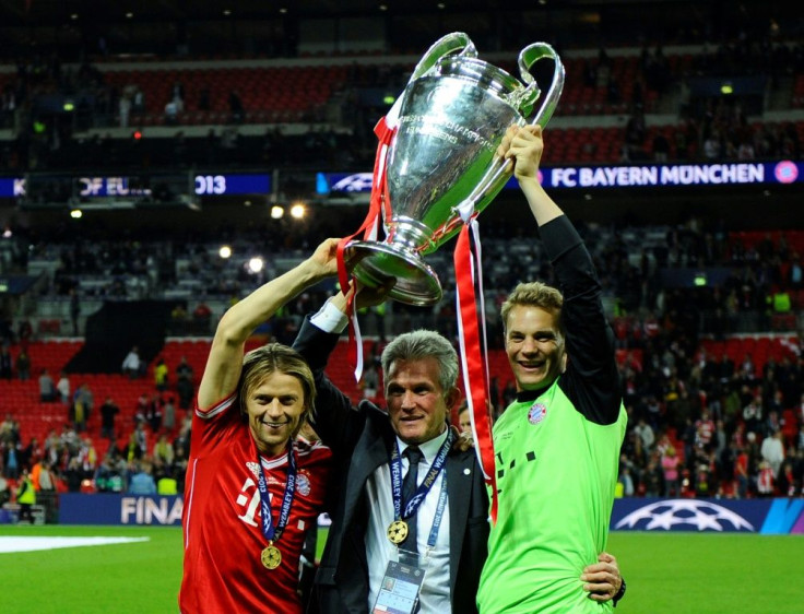 Current Bayern Munich captain Manuel Neuer (R) lifts the Champions League trophy alongside former coach Jupp Heynckes (C) after the 2013 final in London.