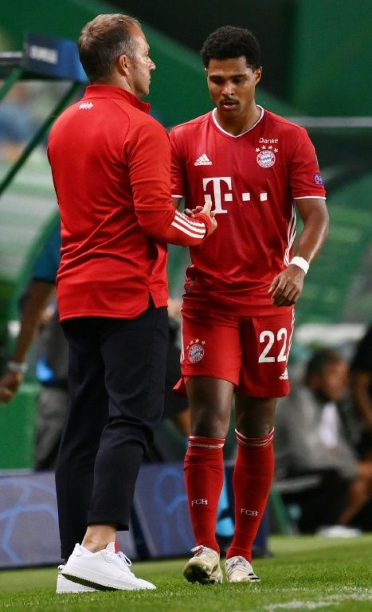 Bayern coach Hansi Flick (L) congratulates goal-scorer Serge Gnabry during Wednesday's semi-final win