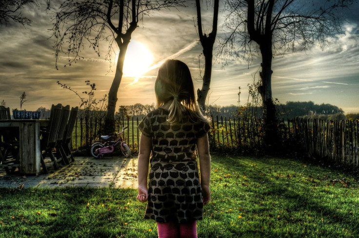 child looking at sunset