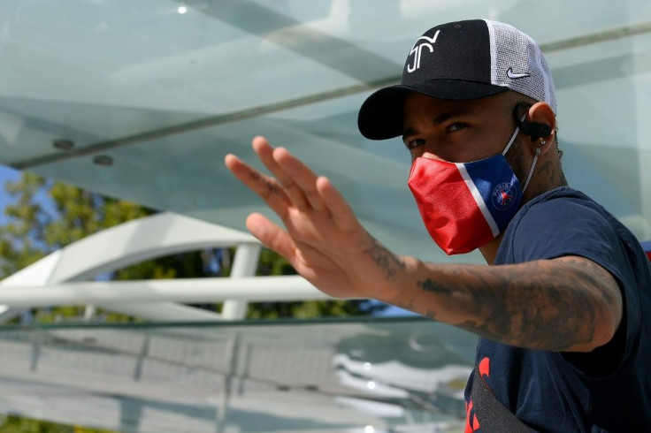 A masked Neymar leaves Paris Saint-Germain's hotel in Lisbon on Friday, as the French side prepare for the Champions League final against Bayern Munich this weekend