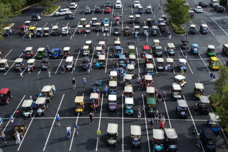 People ready to participate in a pro-Biden golf cart parade on August 21, 2020