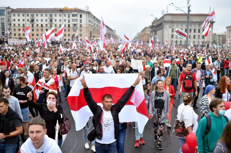 Demonstrators were draped in the red-and-white flags of the opposition