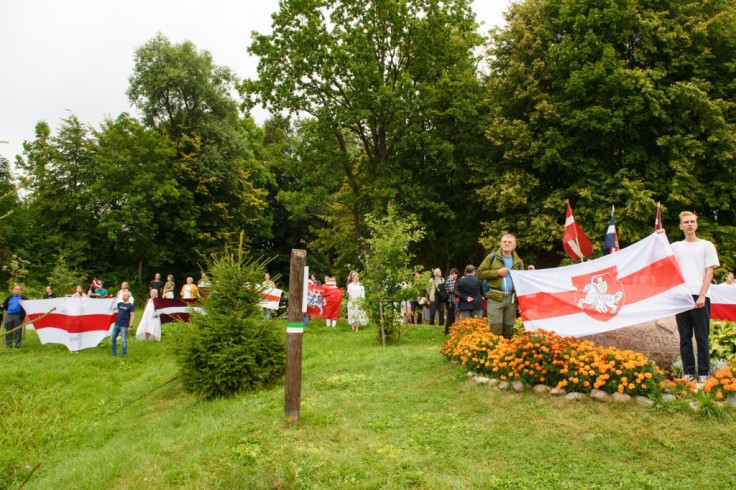 People take part in a solidarity campaign for Belarussians along the border with Belarus in Piedruja, Latvia.