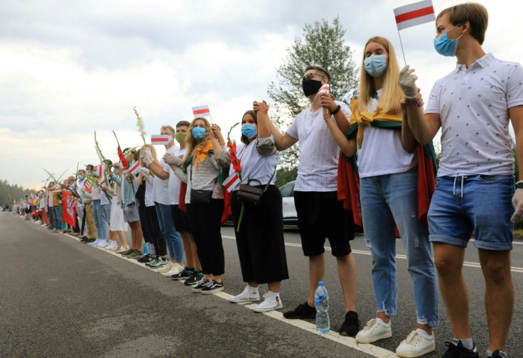 People form a human chain from Vilnius to Medininkai along the border with Belarus to show solidarity with the Belarussian people in Medininkai, Lithuania