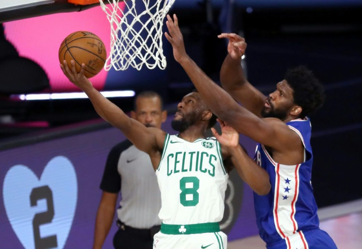 Kemba Walker of the Boston Celtics shoots against Joel Embiid of the Philadelphia 76ers during the first quarter in Game Four