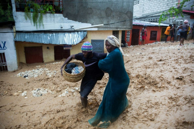 A flooded street in Haiti during the passage of Tropical Storm Laura, which is forecast to strengthen into a hurricane