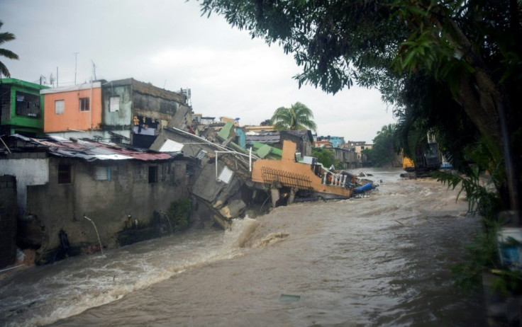Heavy rains in Santo Domingo, the Dominican Republic's capital, caused houses to collapse as Tropical Storm Laura battered the region