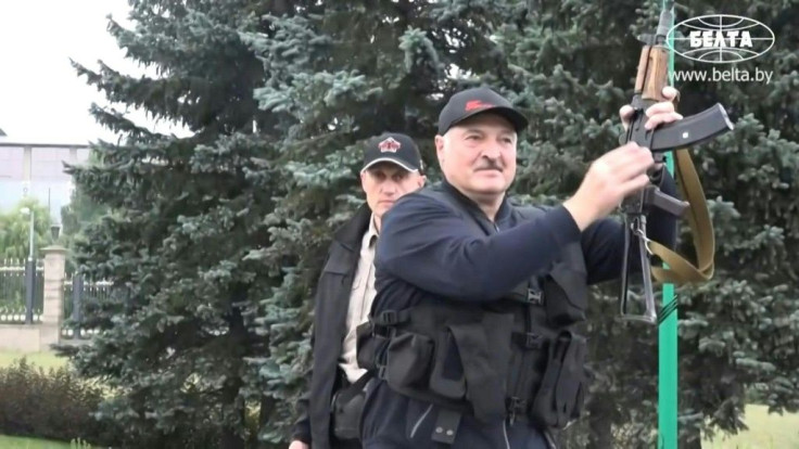 IMAGESBelarus state agency "Belta" releases images of President Alexander Lukashenko holding an automatic rifle and wearing body armour as he arrives, on Sunday evening, at his residence in Minsk, not far from where opposition protests are taking place.