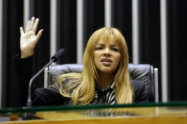 Famous for adopting dozens of street children from Rio de Janeiro's slums, Congresswoman Flordelis dos Santos is accused of ordering her children to murder her husband, a fellow pastor, in a dispute over money and power