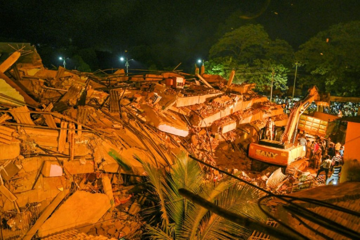 Local residents and police combed through tin sheets, metal rods and other wreckage in a desperate search for survivors as ambulances ferried victims to nearby hospitals