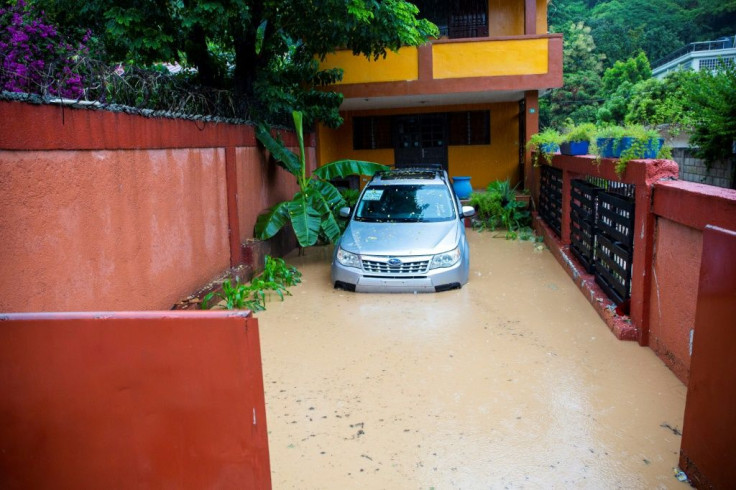 Floodwaters encircle a home in Pietonville, Haiti, after Storm Laura