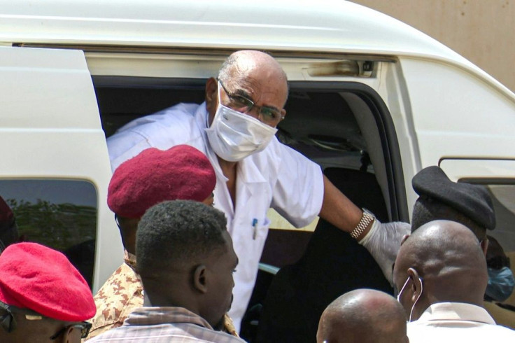 Sudan's ousted president Omar al-Bashir arriving at the start of his trial over the 1989 coup against a democratically elected government that brought him to power