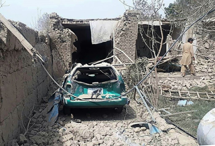A damaged car near the site of the suicide attack