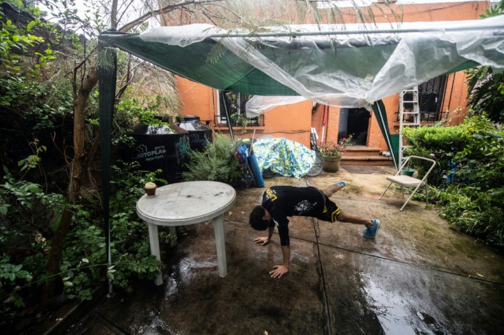 Luis Romero, 27, takes an online Muay Thai martial art class at his home, in Mexico City, on August 14, 2020