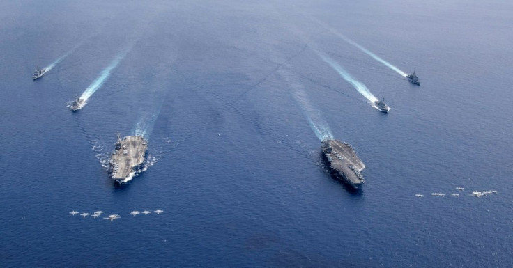 Aircraft carriers the USS Nimitz and USS Ronald Reagan sailing in Asia in July -- Washington is pushing back against Beijing over its military buildup in the South China Sea