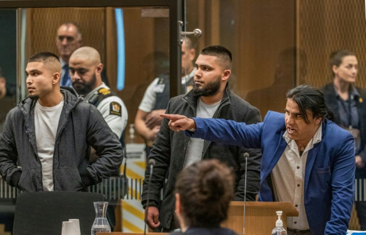 Abdul Aziz (R), who was hailed a hero when he chased the gunman from the Linwood mosque, gestures towards Australian white supremacist Brenton Tarrant at his sentence hearing in Christchurch
