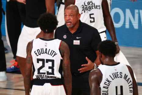 Los Angeles Clippers coach Doc Rivers (C, pictured August 25, 2020) blasted systemic racism and police brutality in the US, saying, "It's amazing to me why we keep loving this country and this country does not love us back"