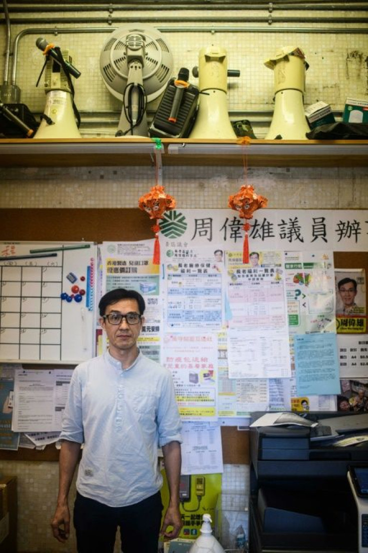 Hong Kong district councillor Chow Wai-hung was arrested under the city's new security law after he raised placards at a protest in late July