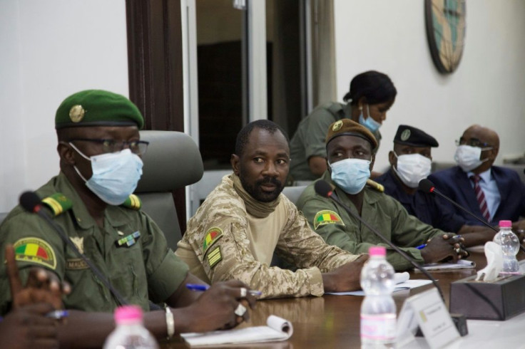 Colonel Assimi Goita, centre, has been granted presidential-like powers as head of the new junta, according to a document posted on Mali's official gazette