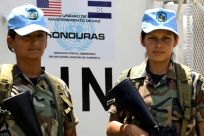 Peacekeepers from Honduras, Maria Sandra Granados (left) and Carme Lara, are photographed on a training mission in Talanga, Honduras on July 29, 2008 before deploying to Haiti