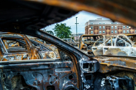 The remains of cars burned during unrest in Kenosha, Wisconsin