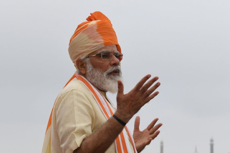 India's Prime Minister Narendra Modi gestures as he gives a speech during a ceremony to celebrate India's 74th Independence Day