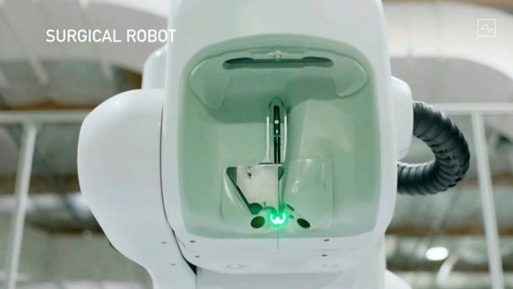 This video grab made from the online Neuralink livestream shows the surgical robot during Elon Musk's Neuralink presentation on August 28, 2020