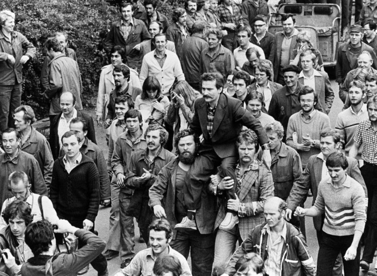 Lech Walesa was carried on fellow dockworkers' shoulders after signing a 1980 pact with Poland's Communist leadership