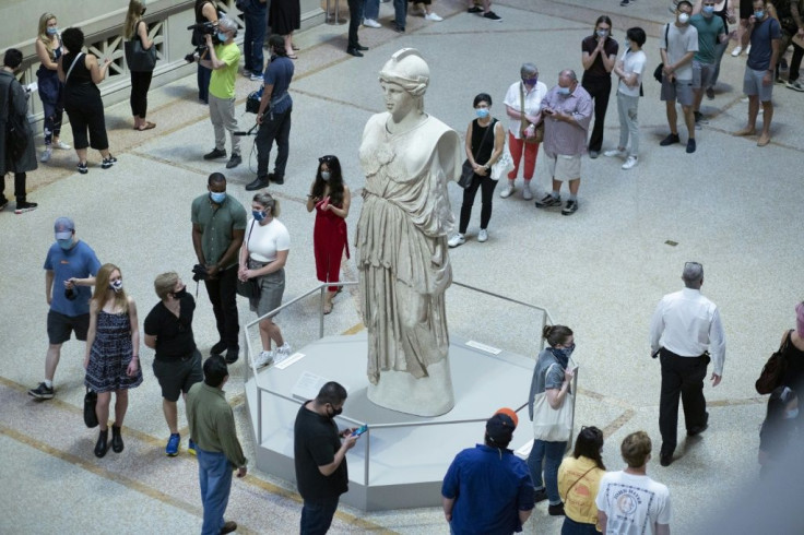 Visitors line up at the entrance to New York's Metropolitan Museum on August 29, 2020 for its reopening after a months-long closing due to the pandemic