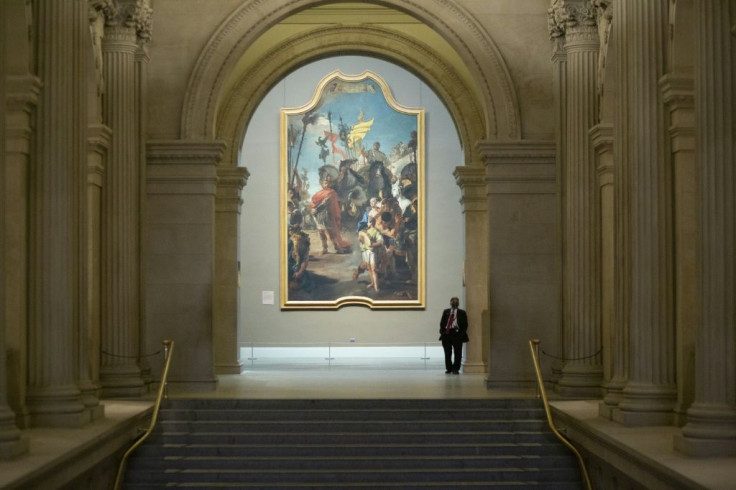 A security guard stands atop a staircase at the Metropolitan Museum, preparing for the New York institution's reopening on August 29, 2020