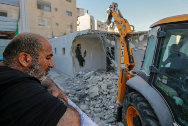 Palestinian owners of homes built without permit in Israeli-annexed east Jerusalem prefer to raze their homes themselves to avoid having to pay thousands of shekels to the city's demolition crews