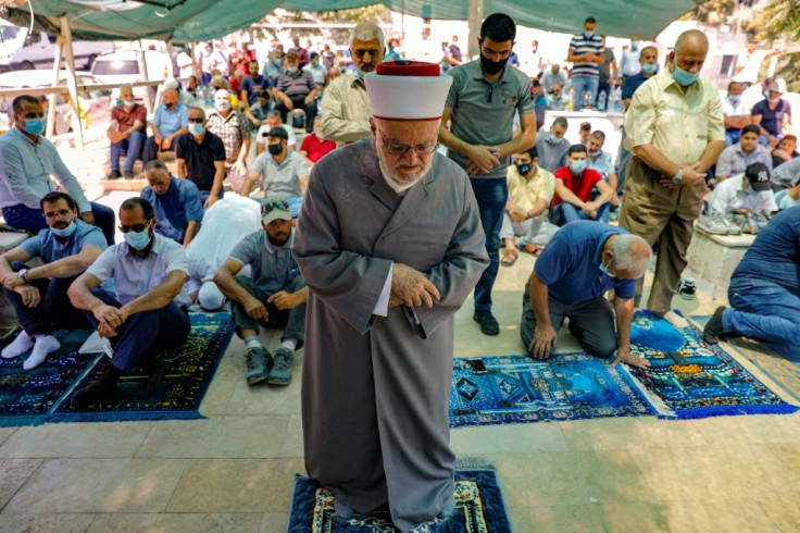 A Palestinian Muslim cleric heads prayers in a protest tent set up by activists against the demolition of houses by Israeli authorities in the mostly Arab east Jerusalem