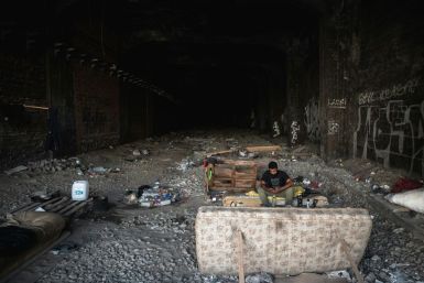 A lonely migrant from Syria on his journey towards Germany, rests in an abandoned railway tunnel in Belgrade