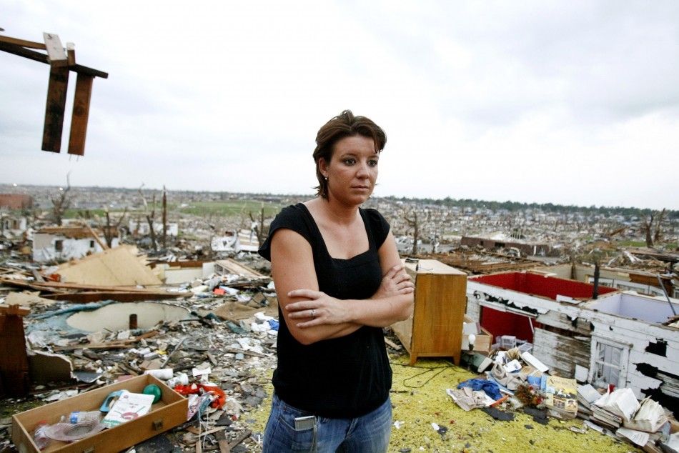 Jamie Haun looks at the damage caused by the May 22 tornado in Joplin