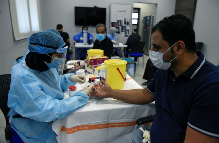 A Bahraini Muslim Shiite mourner gives blood during Ashura commemorations in a suburb of the capital Manama