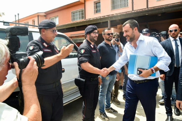 Hardline Italian former interior minister Matteo Salvini, greets police officers in Sicily after closing a immigrant centre in July 2019