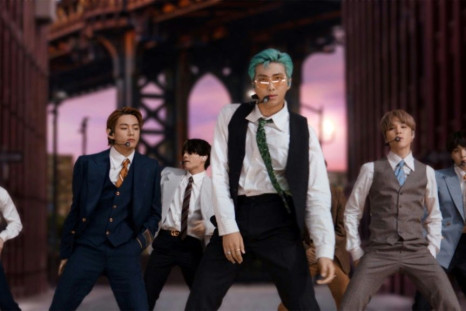 South Korean boy band BTS performing from South Korea during the 2020 MTV Video Music Awards, with iconic New York scenes in the background