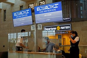 Screens display the flight number of the first-ever commercial flight from Israel to the UAE at the Ben Gurion Airport near Tel Aviv, which will carry a US-Israeli delegation to the UAE following their normalisation accord