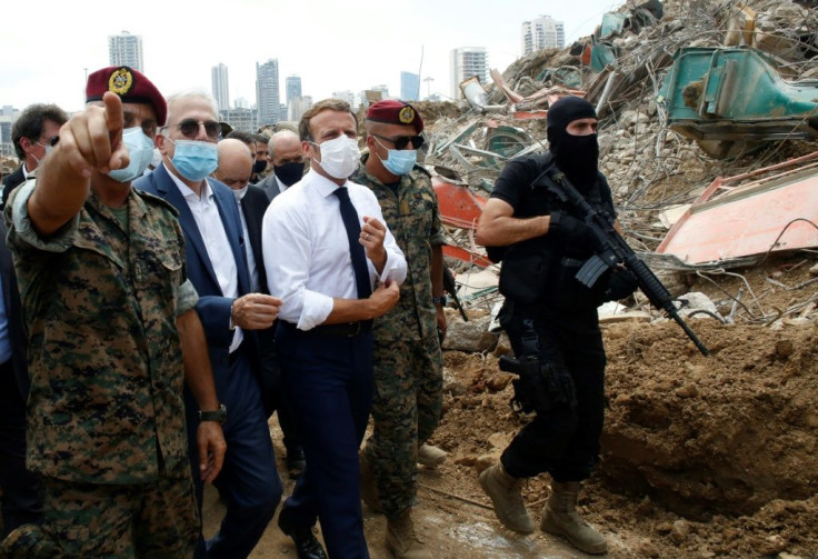 French President Emmanuel Macron visits the devastated site of the explosion at the port of Beirut on August 6
