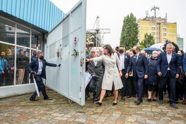 Walesa placed flowers on the shipyard gate and symbolically opened it as he did four decades ago after inking the Gdansk Accords