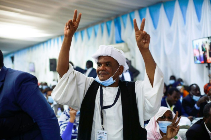 A Sudanese man celebrates at the signing of the Sudan peace deal with rebel movements in Juba, South Sudan