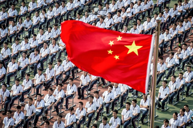 Students at the 100th anniversary of the founding of Wuhan High School on the first day of the new semester in the city in China's central Hubei province