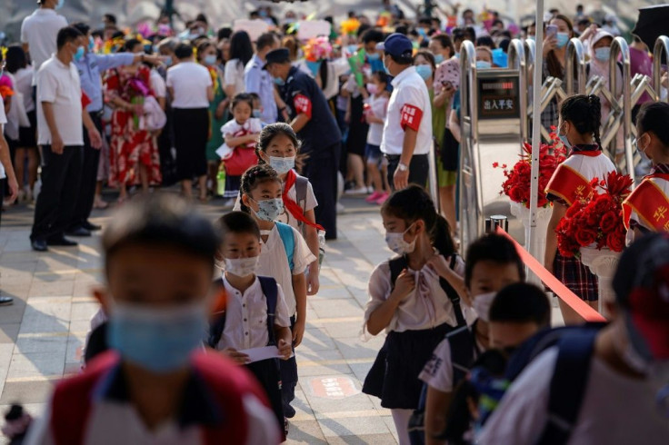 Elementary school students arrive on the first day of the new semester in Wuhan