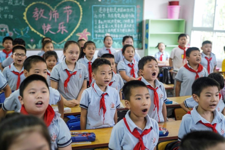 Elementary school students attend a class on the first day of the new semester in Wuhan