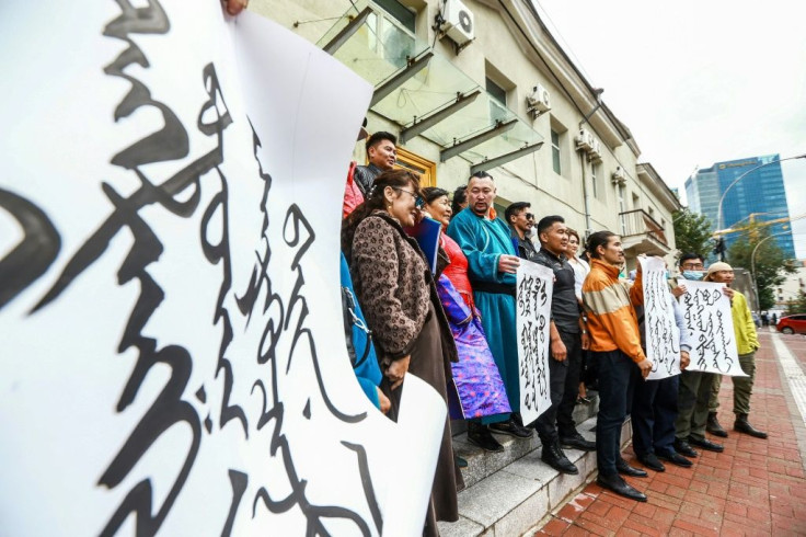 Mongolians protest at the foreign ministry in Ulaanbaatar, capital of Mongolia, against China's plan to introduce Mandarin-only classes at schools in the neighbouring Chinese region of Inner Mongolia