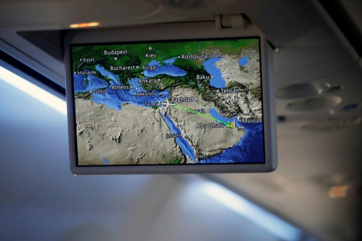 A screen displays a map showing the route of Monday's maiden flight from Israel across Saudi Arabia to UAE