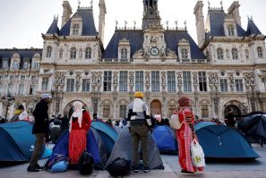 Tents belonging to those living on the streets are a rare sight outside Paris' opulent town hall