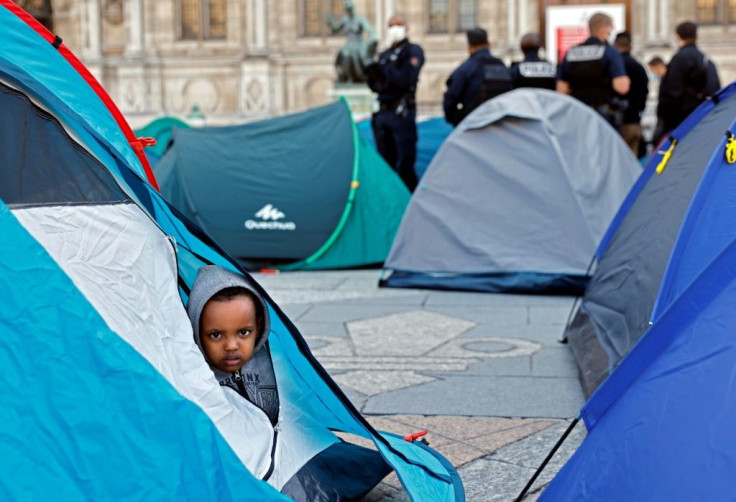 Children were among those cleared out by police from in front of Paris' town hall