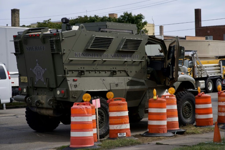 Security vehicles gathered on September 1, 2020 in Kenosha, Wisconsin, where US President Donald Trump was visiting following days of violent unrest in the aftermath of the shooting of a black man by police