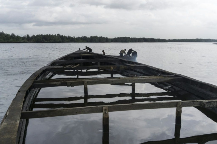 Nigeria's oil-rich Niger delta is prone to corruption and mismanagement, officials say. Here we see an abandoned boat filled with oil near the city of Port Harcourt